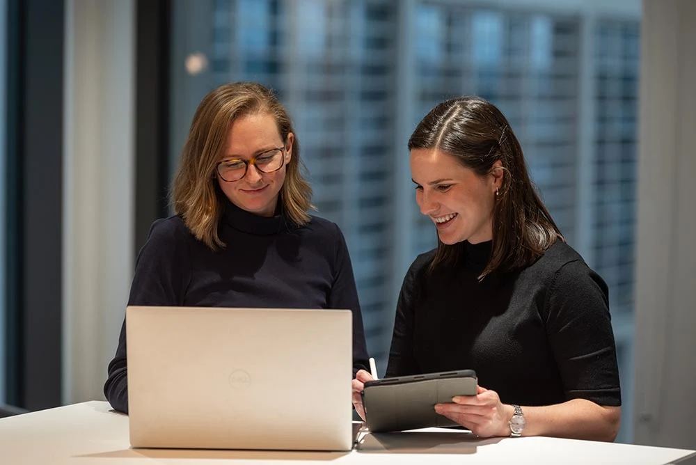 Two colleagues working together in an office